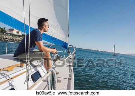 Man enjoying view on sailboat, San Diego Bay, California, USA View Large Photo Image Stock Image - Man enjoying view on sailboat, San Diego Bay, California, USA. Fotosearch
