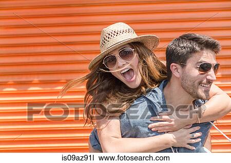 Man giving friend piggyback, Coney island, Brooklyn, New York, USA View Large Photo Image Stock Image - Man giving friend piggyback, Coney island, Brooklyn, New York, USA. Fotosearch