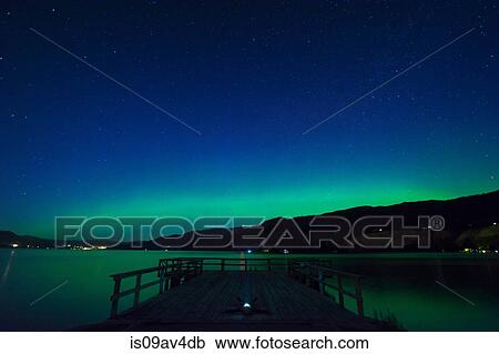 Man lying on pier star gazing at night, Wharf Park, Naramata, British Columbia, Canada View Large Photo Image Stock Image - Man lying on pier star gazing at night, Wharf Park, Naramata, British Columbia, Canada. Fotosearch
