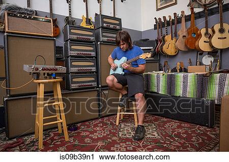 Stock Image - Man playing guitar. Fotosearch