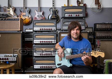 Stock Image - Man playing guitar. Fotosearch