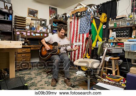 Stock Photo - Man playing guitar. Fotosearch
