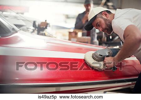 Man polishing boat in repair workshop View Large Photo Image Stock Photography - Man polishing boat in repair workshop. Fotosearch