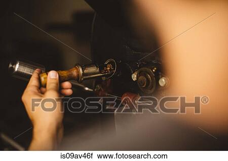 Man pouring coffee beans into coffee roaster, rear view View Large Photo Image Stock Image - Man pouring coffee beans into coffee roaster, rear view. Fotosearch