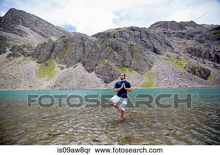 Man practising yoga, Cathedral Lake, Aspen, Colorado View Large Photo Image Stock Photography - Man practising yoga, Cathedral Lake, Aspen, Colorado. Fotosearch