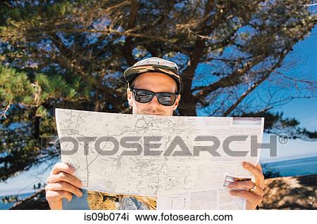 Man reading map at coast, Big Sur, California, USA View Large Photo Image Stock Image - Man reading map at coast, Big Sur, California, USA. Fotosearch