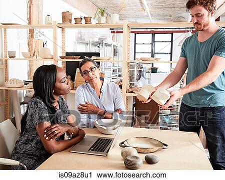 Man showing colleagues ceramic samples View Large Photo Image Stock Image - Man showing colleagues ceramic samples. Fotosearch