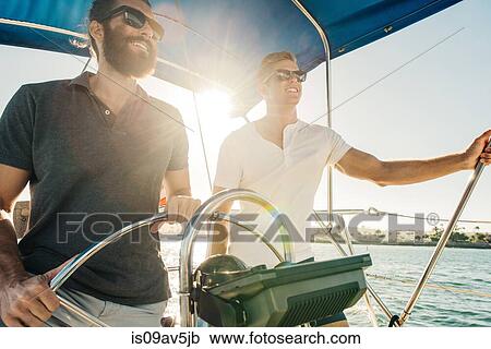 Man steering wheel of sailboat, San Diego Bay, California, USA View Large Photo Image Stock Image - Man steering wheel of sailboat, San Diego Bay, California, USA. Fotosearch