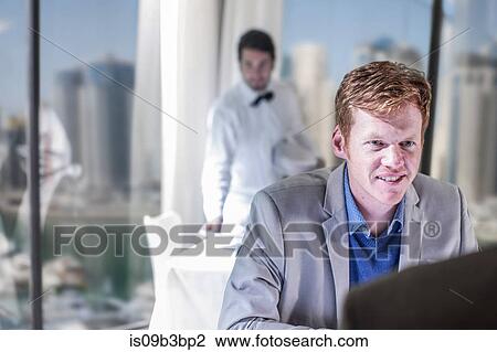Man talking over lunch in hotel restaurant View Large Photo Image Stock Image - Man talking over lunch in hotel restaurant. Fotosearch