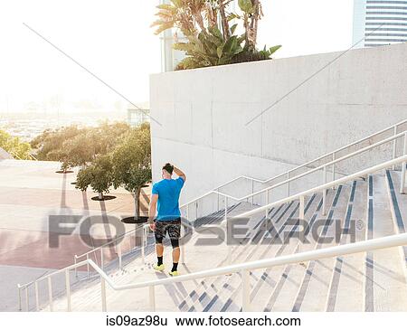 Man training, on stairway at sport facility, downtown San Diego, California, USA View Large Photo Image Stock Photograph - Man training, on stairway at sport facility, downtown San Diego, California, USA. Fotosearch
