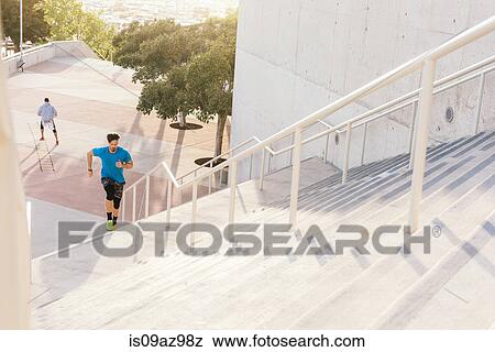 Man training, running up stairway at sport facility, downtown San Diego, California, USA View Large Photo Image Stock Photo - Man training, running up stairway at sport facility, downtown San Diego, California, USA. Fotosearch