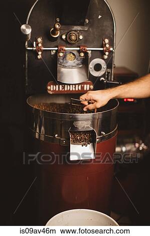 Man using coffee roaster View Large Photo Image Picture - Man using coffee roaster. Fotosearch