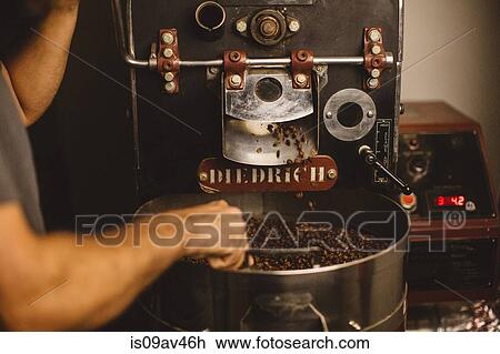 Man using coffee roaster View Large Photo Image Stock Image - Man using coffee roaster. Fotosearch