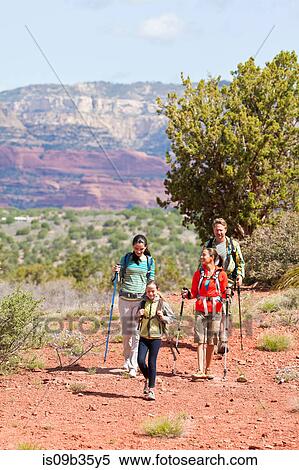 Stock Photography - Mature couple and two daughters hiking in landscape, Sedona, Arizona, USA. Fotosearch