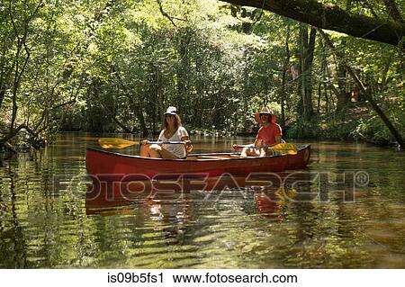Mature couple in canoe, Econfina Creek, Youngstown, Florida, USA View Large Photo Image Stock Image - Mature couple in canoe, Econfina Creek, Youngstown, Florida, USA. Fotosearch