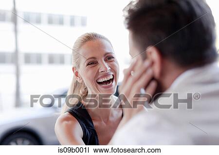 Mature man and woman, face to face, woman touching man's face, laughing View Large Photo Image Stock Image - Mature man and woman, face to face, woman touching man's face, laughing. Fotosearch