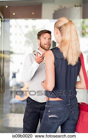 Mature man and woman outdoors, having animated discussion View Large Photo Image Stock Image - Mature man and woman outdoors, having animated discussion. Fotosearch