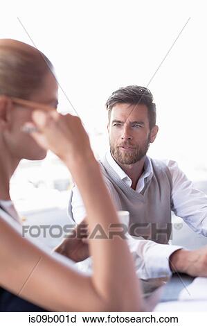 Mature man and woman sitting outside cafe View Large Photo Image Stock Image - Mature man and woman sitting outside cafe. Fotosearch