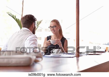 Mature man and woman, sitting outside cafe, drinking coffee, face to face, smiling View Large Photo Image Stock Image - Mature man and woman, sitting outside cafe, drinking coffee, face to face, smiling. Fotosearch