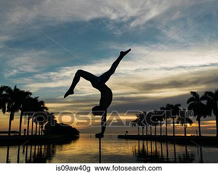 Mature man balancing on pole, dusk, South Pointe Park, South Beach, Miami, Florida, USA View Large Photo Image Stock Image - Mature man balancing on pole, dusk, South Pointe Park, South Beach, Miami, Florida, USA. Fotosearch
