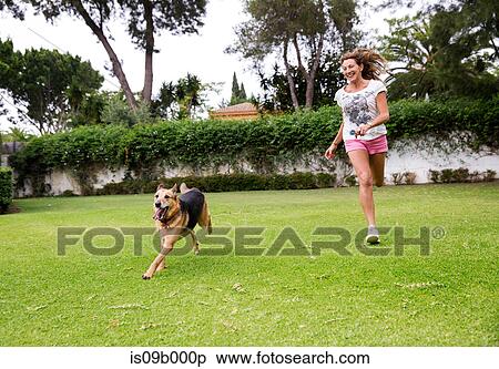 Mature woman running in park with dog View Large Photo Image Stock Photography - Mature woman running in park with dog. Fotosearch