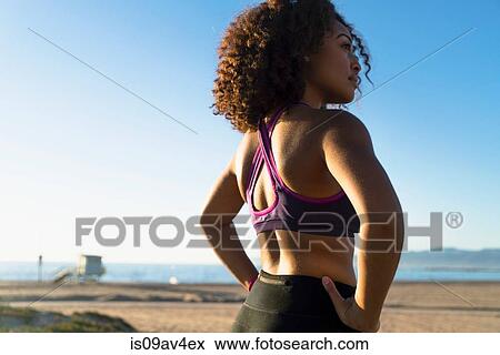 Mid adult woman, hands on hips, rear view View Large Photo Image Stock Photo - Mid adult woman, hands on hips, rear view. Fotosearch