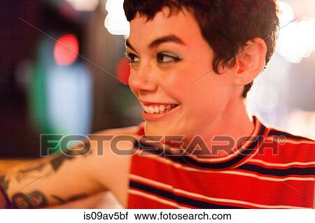 Mid adult woman, smiling, looking away View Large Photo Image Stock Image - Mid adult woman, smiling, looking away. Fotosearch