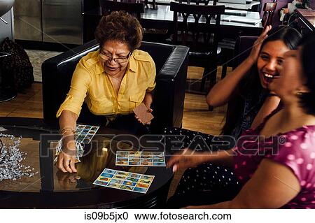 Mother, grandmother and girl playing game View Large Photo Image Stock Image - Mother, grandmother and girl playing game. Fotosearch