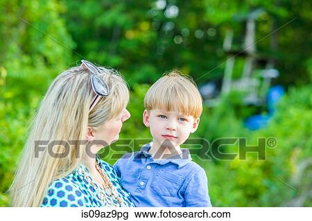 Mother holding son View Large Photo Image Stock Image - Mother holding son. Fotosearch