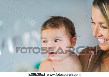 Mother playing with toddler in arms View Large Photo Image Stock Image - Mother playing with toddler in arms. Fotosearch