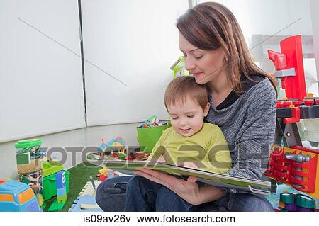 Mother reading to son at home View Large Photo Image Stock Photo - Mother reading to son at home. Fotosearch