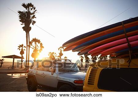 Multi-coloured surfboards tied onto vehicle, Venice Beach, Los Angeles, USA View Large Photo Image Picture - Multi-coloured surfboards tied onto vehicle, Venice Beach, Los Angeles, USA. Fotosearch