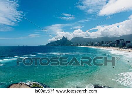 Stock Image - Ocean waves lapping the coastline, Ipanema Beach, Rio de Janeiro, Brazil. Fotosearch