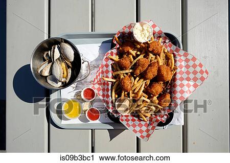 Overhead view of fried seafood and french fries on tray with bowl of scallops, Lunenburg, Nova Scotia, Canada View Large Photo Image Stock Image - Overhead view of fried seafood and french fries on tray with bowl of scallops, Lunenburg, Nova Scotia, Canada. Fotosearch