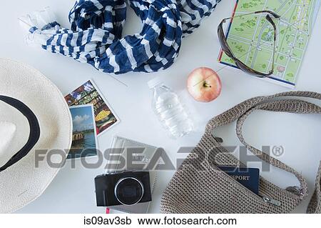 Stock Image - Overhead view of items being prepared for sightseeing on city break. Fotosearch