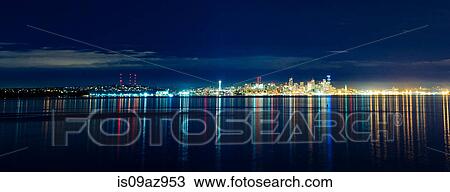 Panoramic view of distant skyline and city lights at night, Seattle, Washington, USA View Large Photo Image Stock Image - Panoramic view of distant skyline and city lights at night, Seattle, Washington, USA. Fotosearch