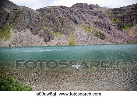 Stock Photograph - Person swimming, Cathedral Lake, Aspen, Colorado. Fotosearch