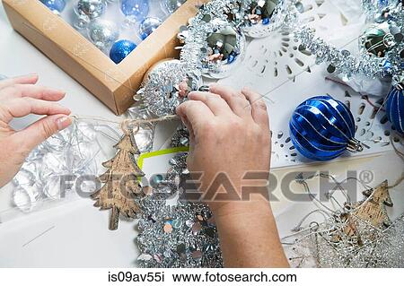 Person's hands preparing christmas decorations View Large Photo Image Stock Image - Person's hands preparing christmas decorations. Fotosearch