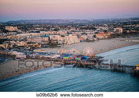 Stock Photograph - Pier and beach with amusement park, high angle, Santa Monica, California, USA. Fotosearch