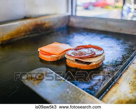 Pork roll sandwich cooking on catering van griddle View Large Photo Image Stock Image - Pork roll sandwich cooking on catering van griddle. Fotosearch