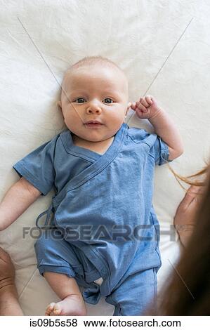 Stock Photo - Portrait of baby boy, overhead view. Fotosearch