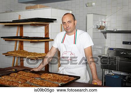 Picture - Portrait of baker in bakery. Fotosearch