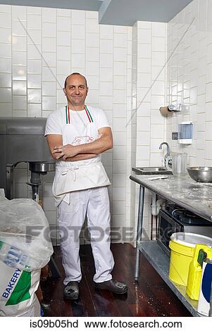 Stock Image - Portrait of baker in bakery. Fotosearch