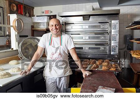 Stock Photo - Portrait of baker in bakery. Fotosearch