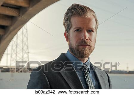 Portrait of bearded businessman looking at camera, Los Angeles river, California, USA View Large Photo Image Stock Image - Portrait of bearded businessman looking at camera, Los Angeles river, California, USA. Fotosearch