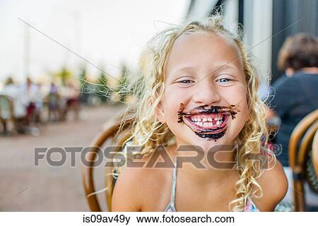 Portrait of blond haired girl at sidewalk cafe with sauce covered mouth View Large Photo Image Stock Photo - Portrait of blond haired girl at sidewalk cafe with sauce covered mouth. Fotosearch