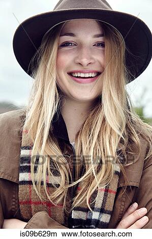 Portrait of blond haired young woman in outdoor clothes View Large Photo Image Picture - Portrait of blond haired young woman in outdoor clothes. Fotosearch
