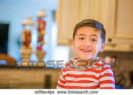 Portrait of cute boy in kitchen View Large Photo Image Stock Photo - Portrait of cute boy in kitchen. Fotosearch