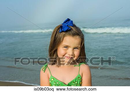 Portrait of cute girl wearing hair ribbon on beach, Asbury Park, New Jersey, USA View Large Photo Image Stock Photography - Portrait of cute girl wearing hair ribbon on beach, Asbury Park, New Jersey, USA. Fotosearch