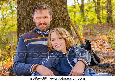 Portrait of father and son in forest View Large Photo Image Stock Photograph - Portrait of father and son in forest. Fotosearch